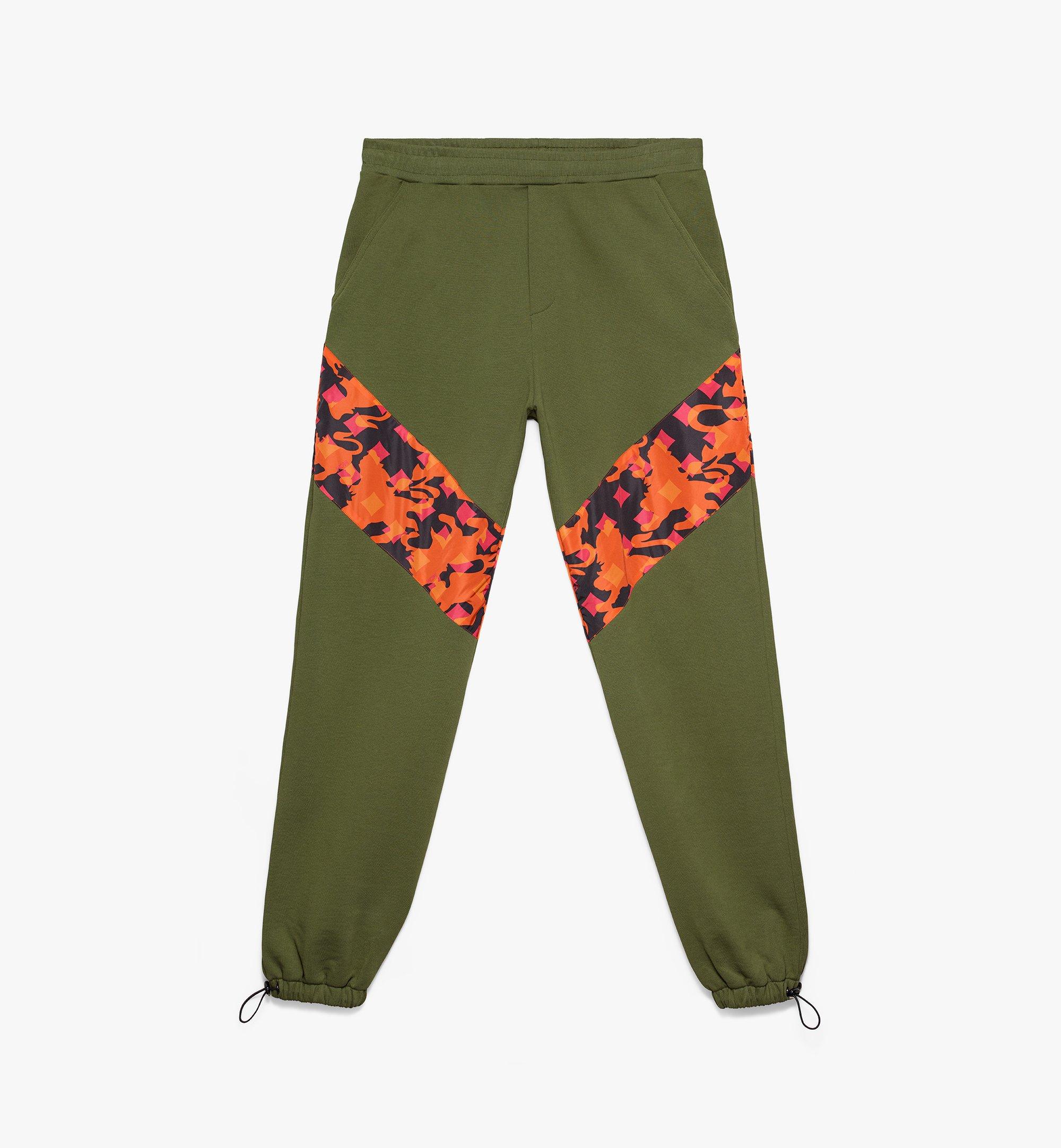 green and orange track pants