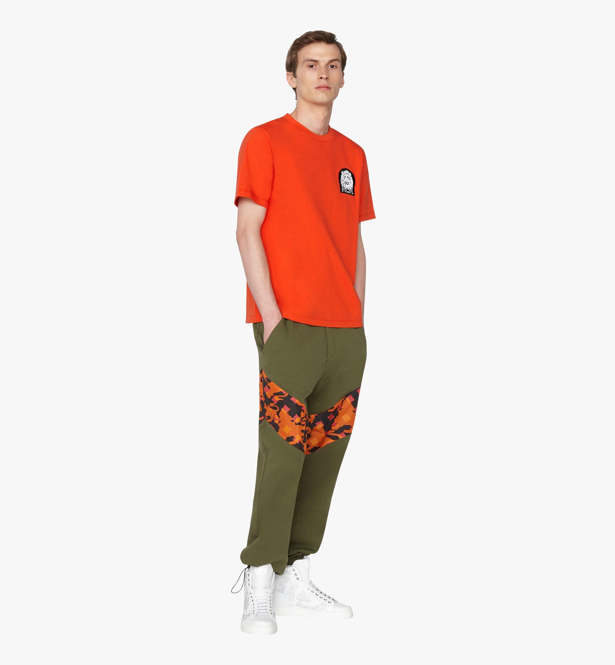 green and orange track pants