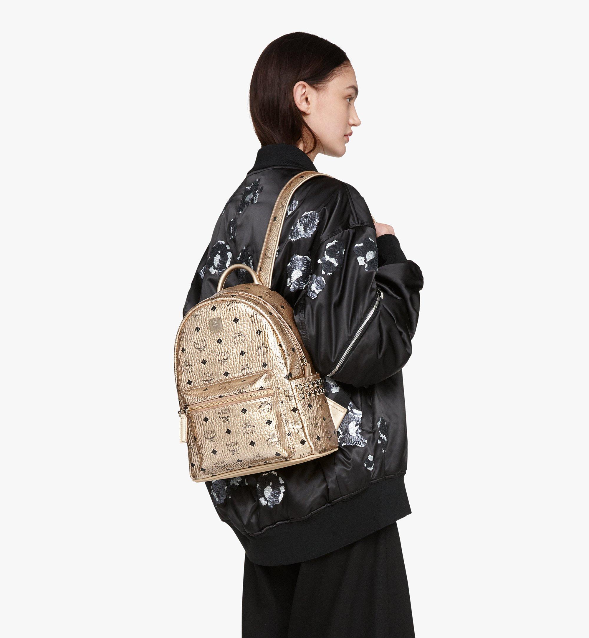 Gold store mcm backpack