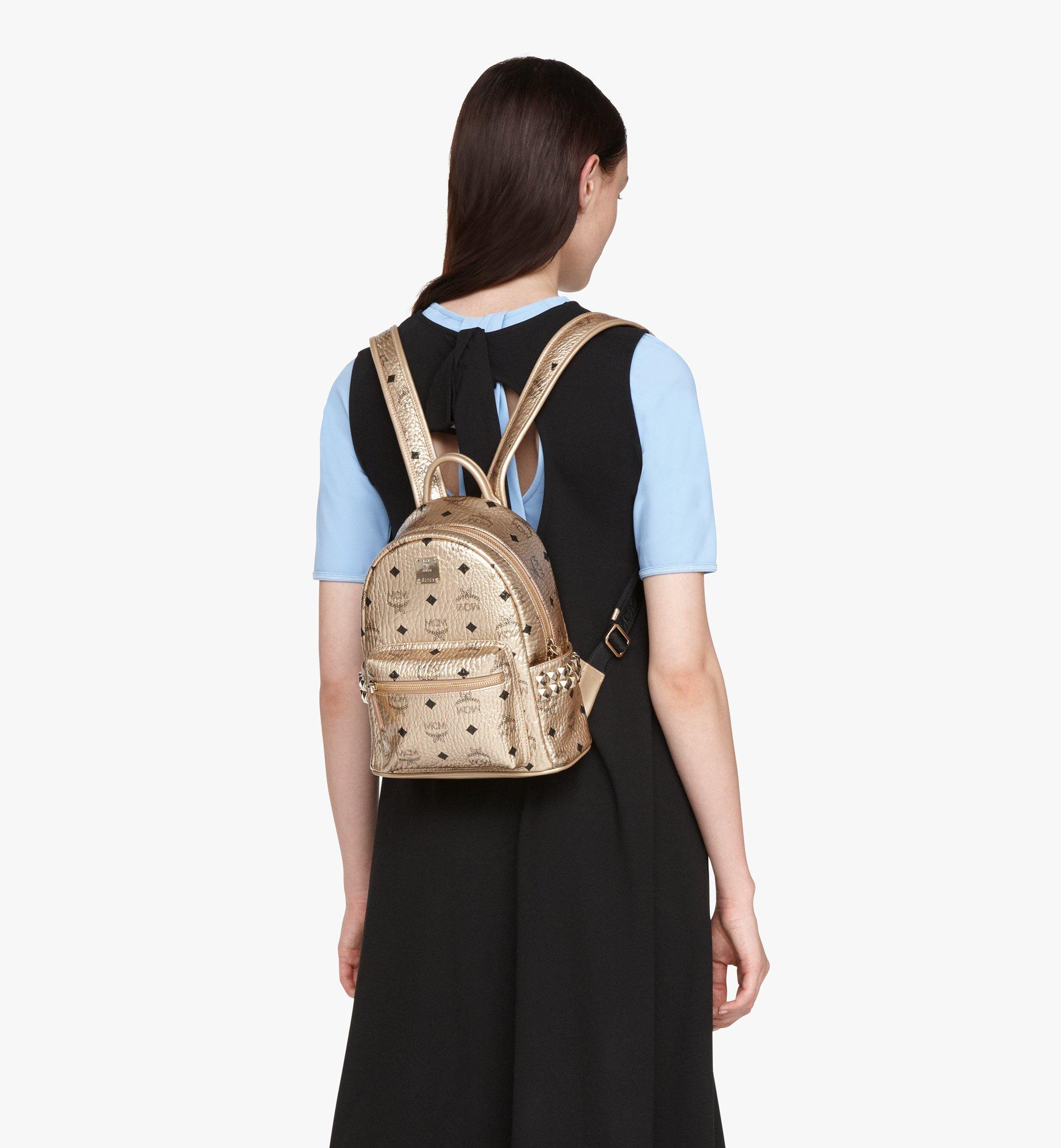 Gold store mcm backpack