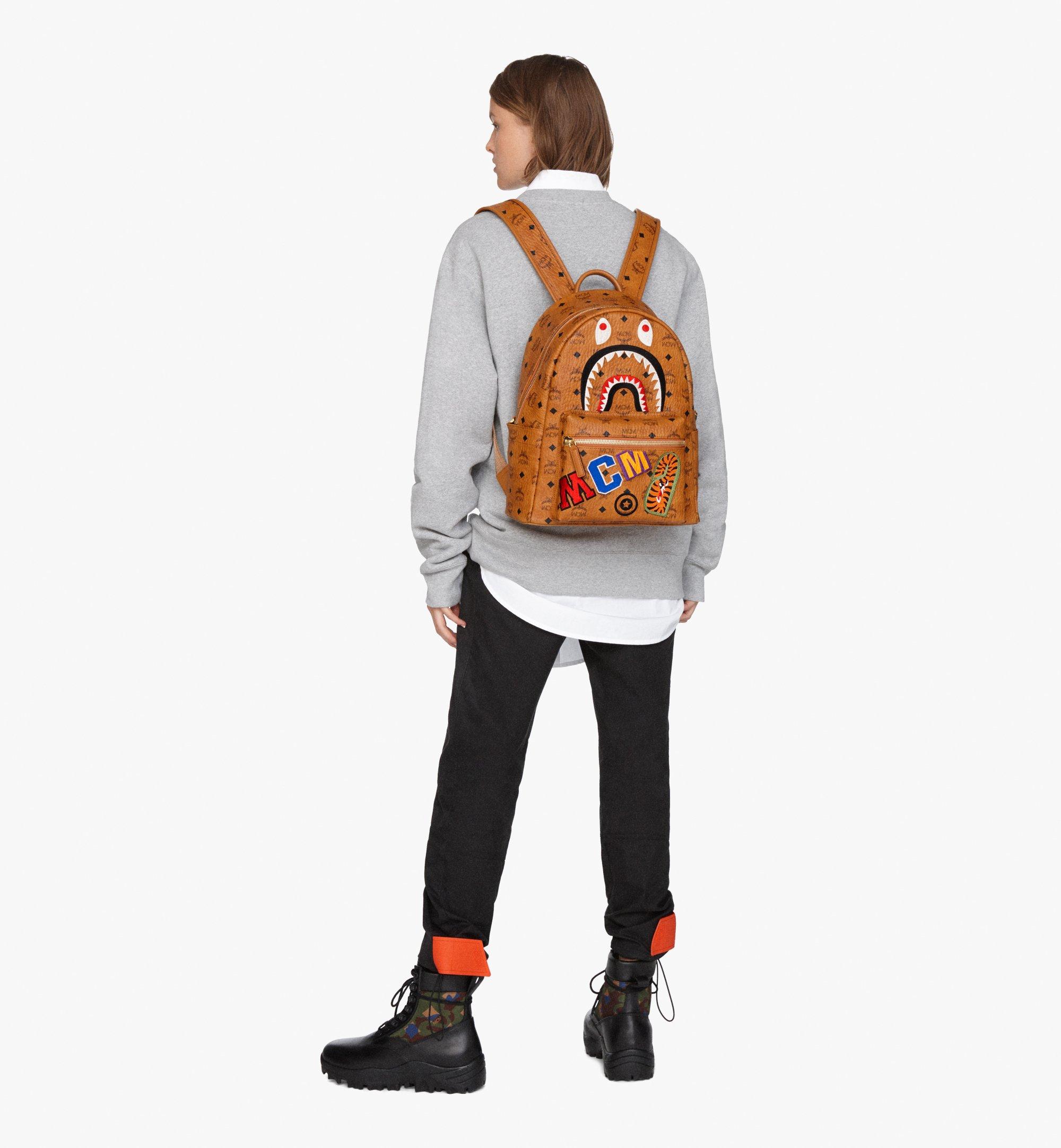 MCM x BAPE Shark Stark Backpack Visetos Cognac in Coated Canvas with 24k  Gold Plated - US