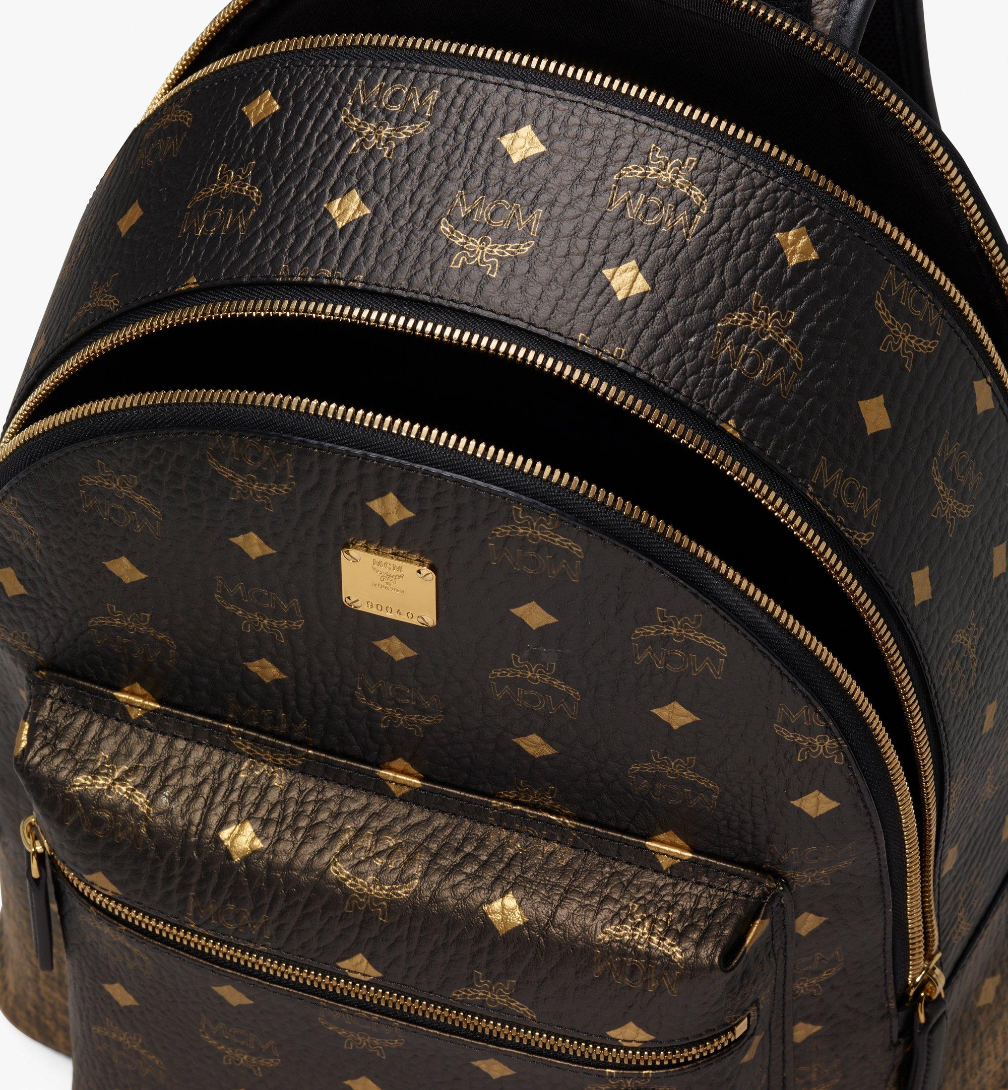 Mcm gold backpack sale