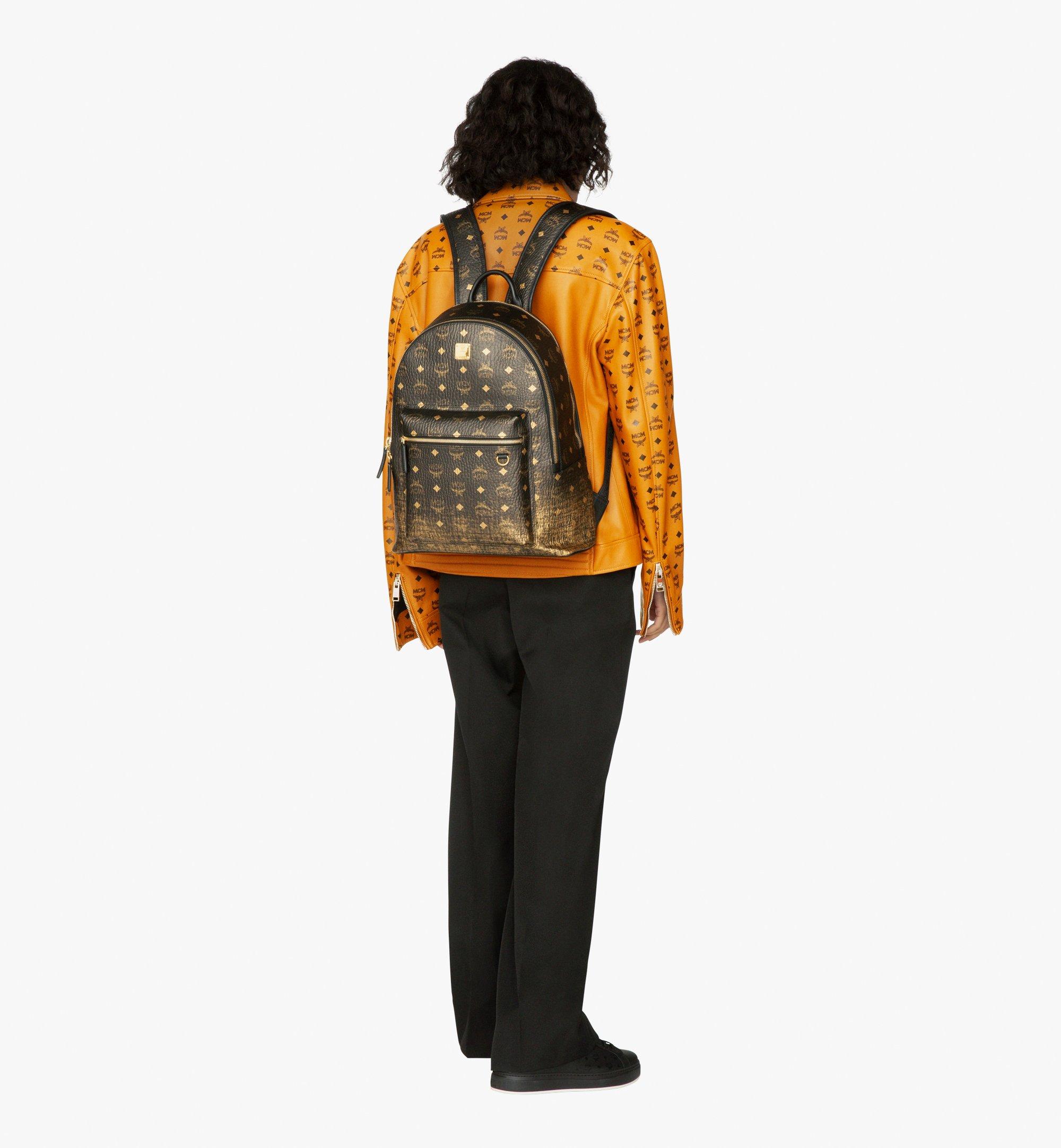 Black and shop gold mcm backpack