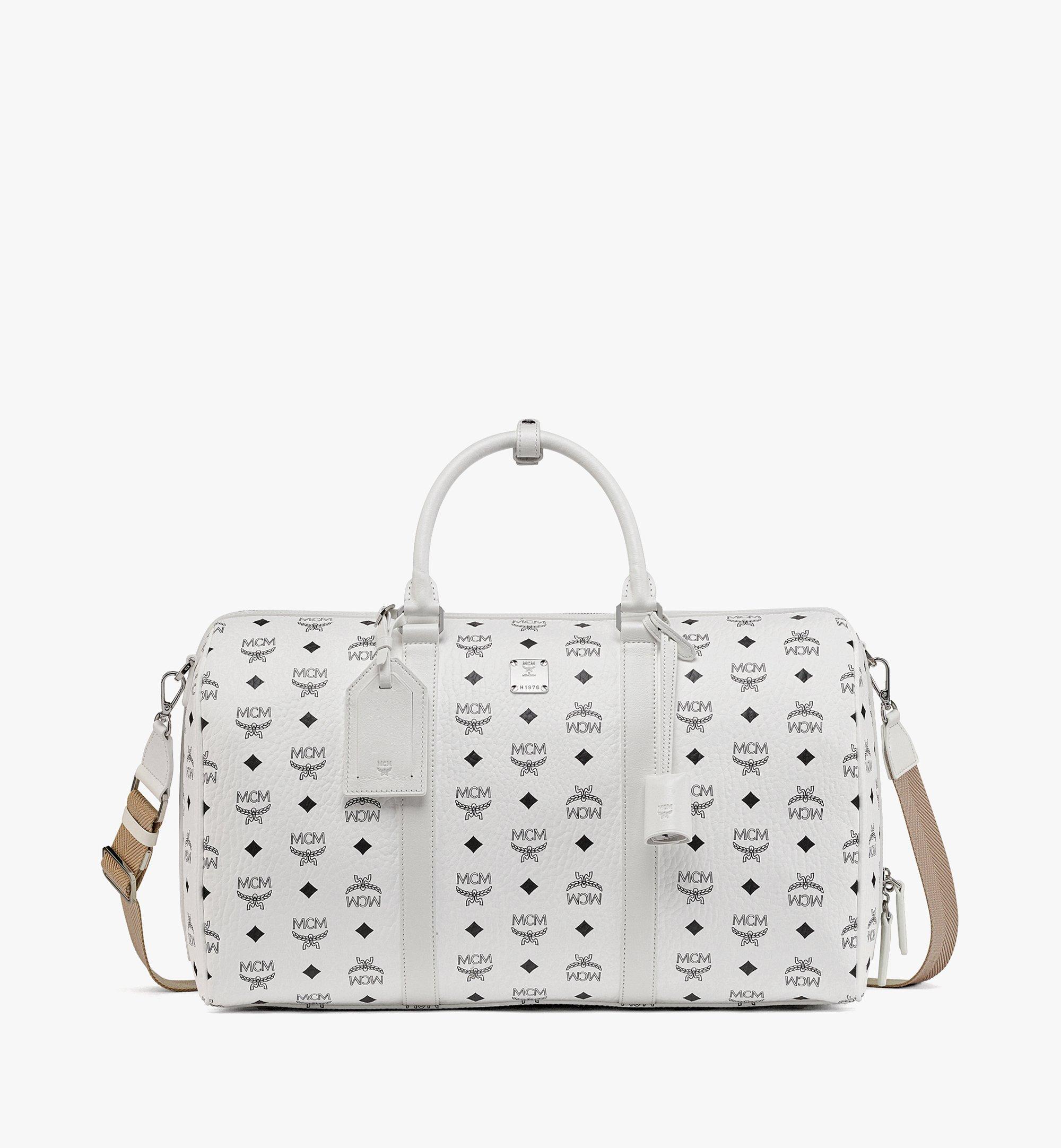 White mcm 2025 bag with patches