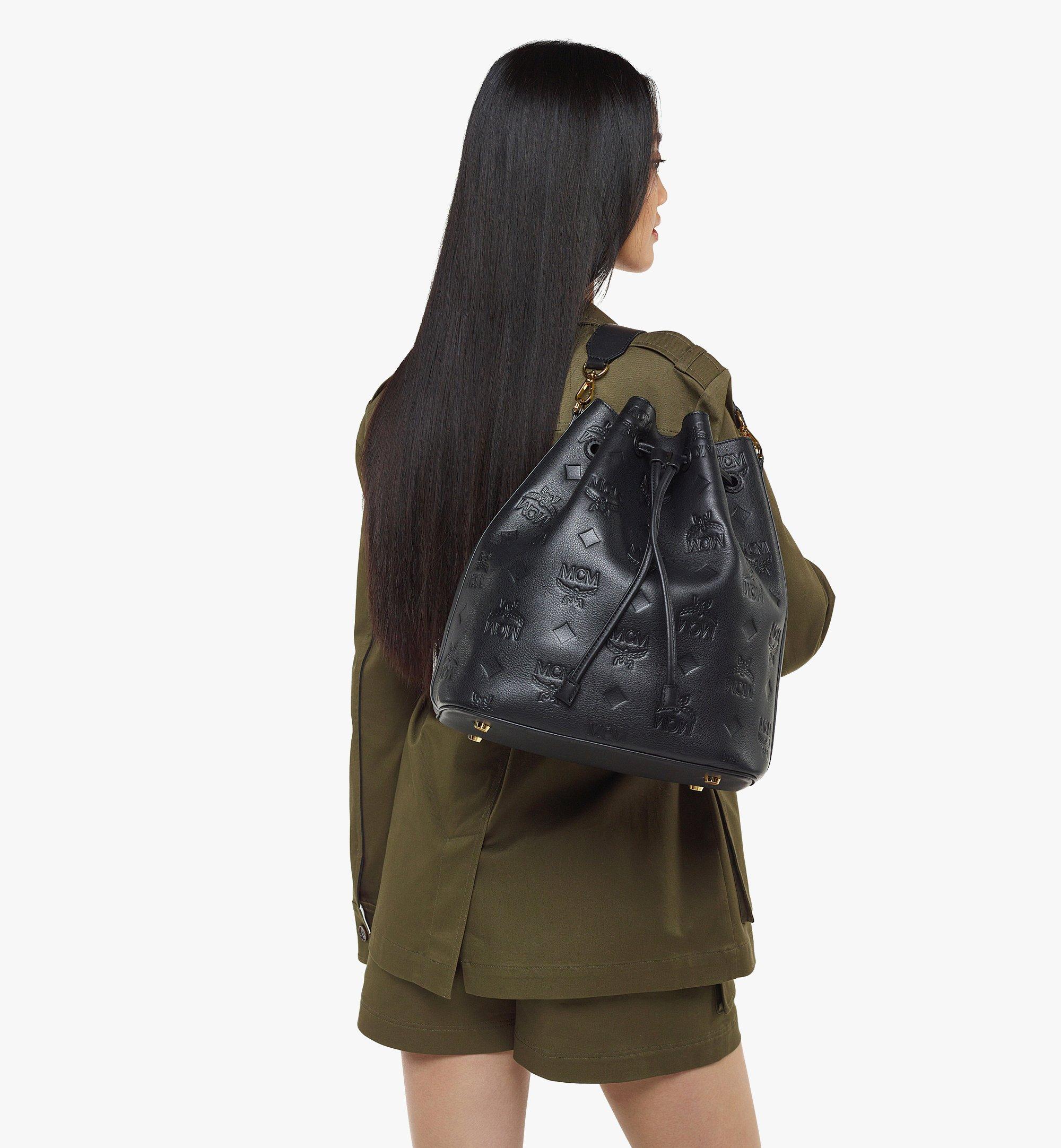 All Over Monogram Embossed Backpack with Drawstring Closure