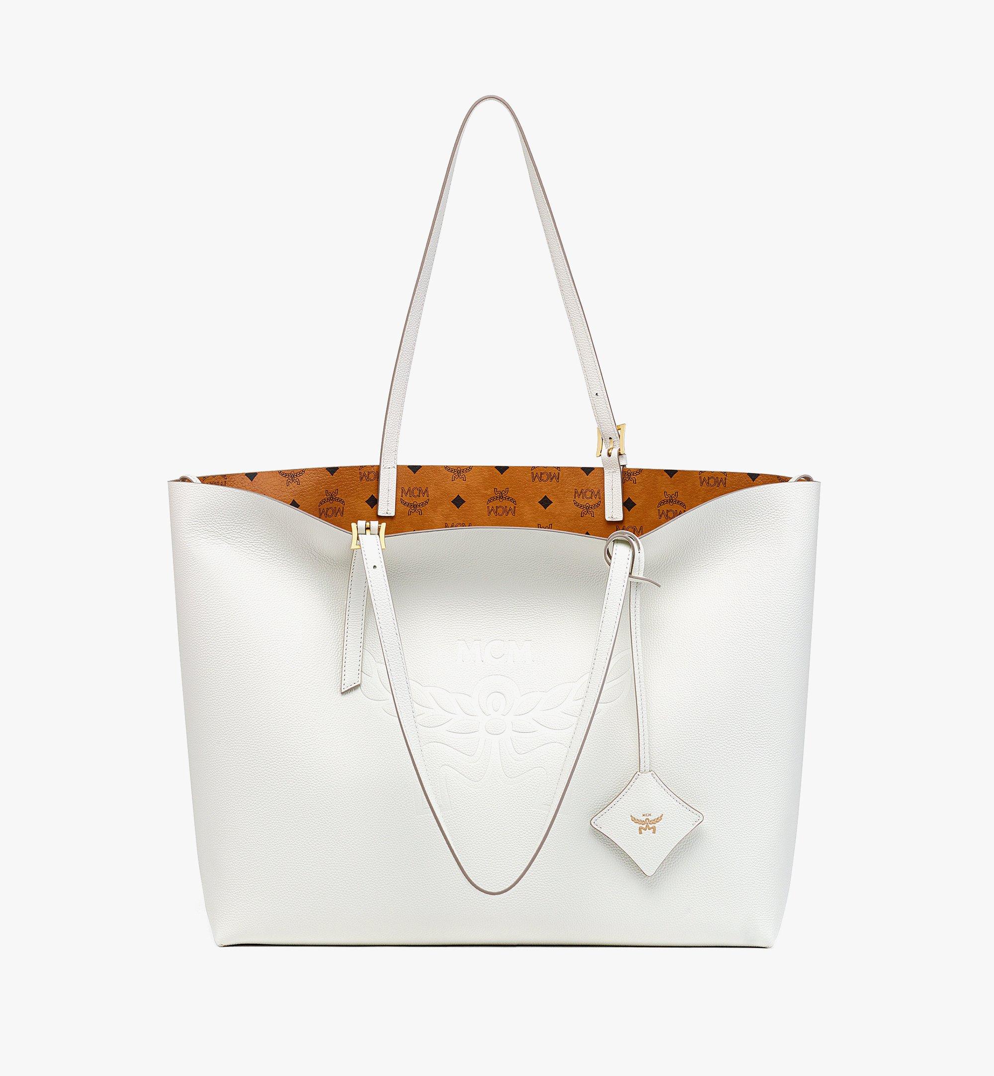 Embossed monogram motif online leather tote