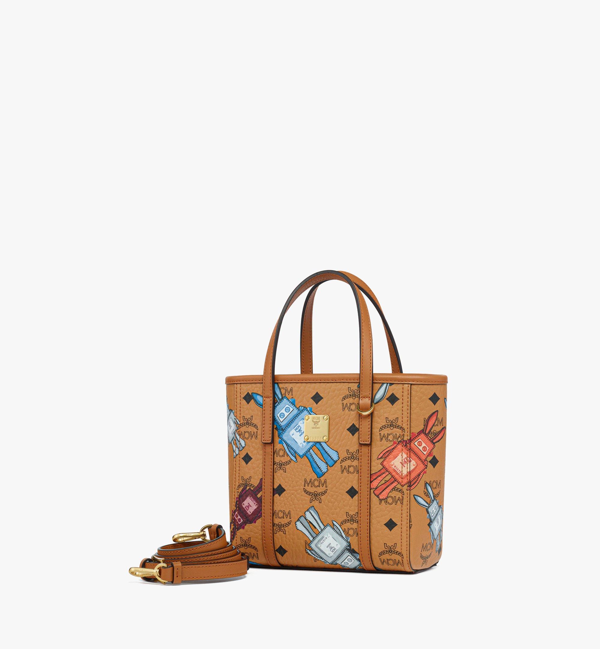 MCM ブラウンレザーショルダーバッグMini TONI トップジップショッパー X-Mini Toni Top-Zip Shopper in Visetos Cognac | MCM ®US