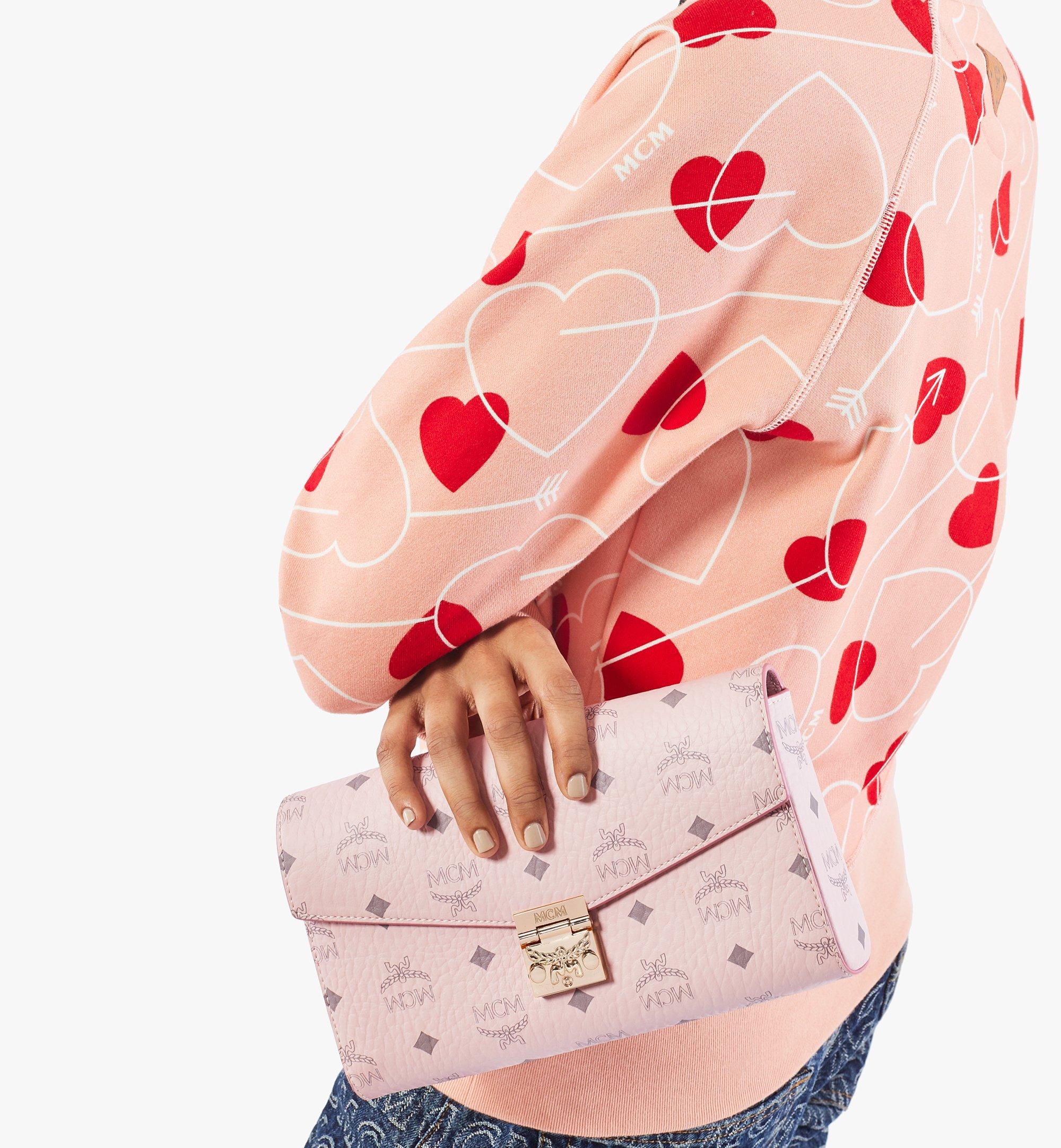 Mcm sling bag pink online