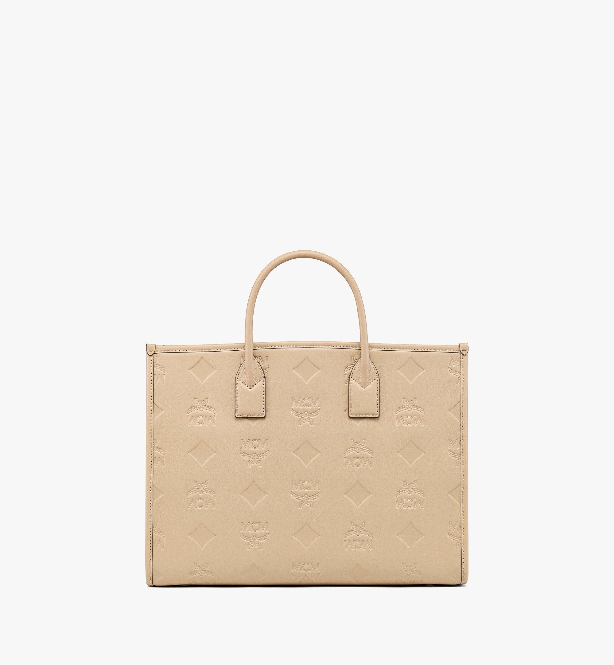 MCM กระเป๋าโท้ท München ทำจากหนังแก้วลายโมโนแกรม Maxi Beige MWTDABO14I7001 มุมมองอื่น 3